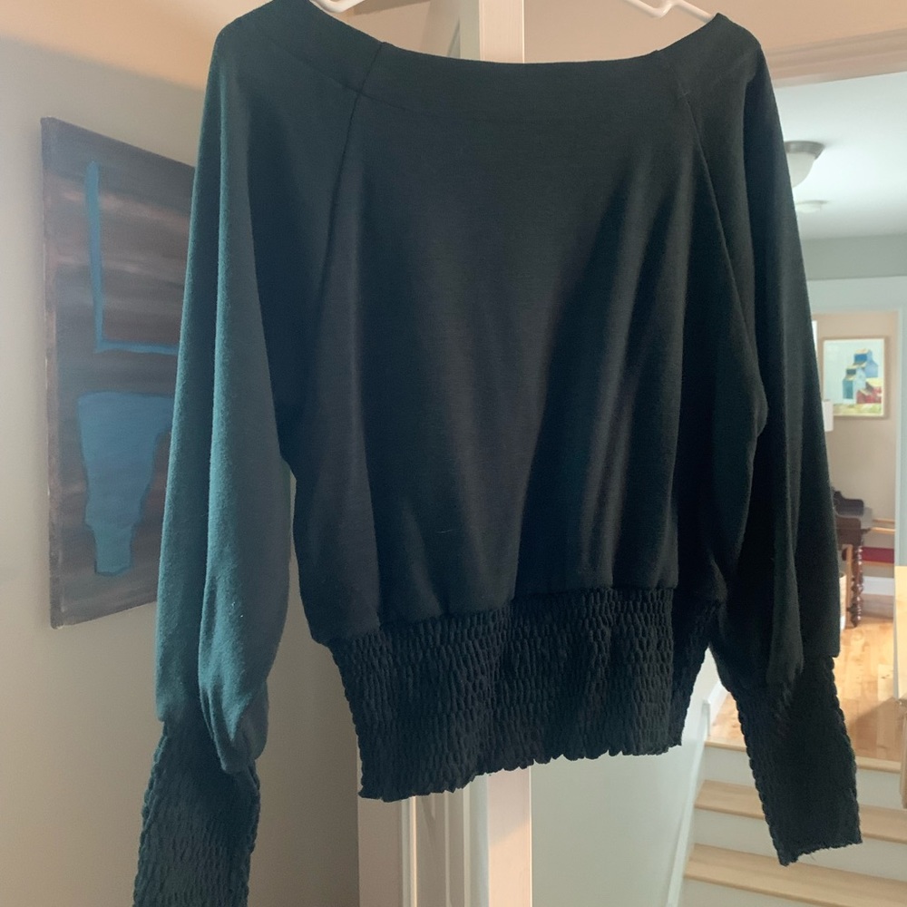 Emerald green sweater.